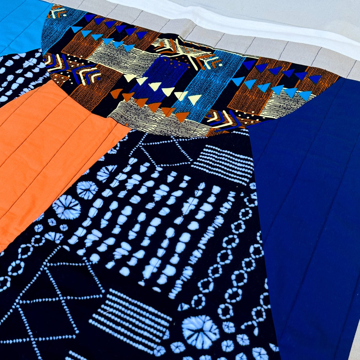 Abundance Baby Quilt - Black + Blue with Orange Sun Ray
