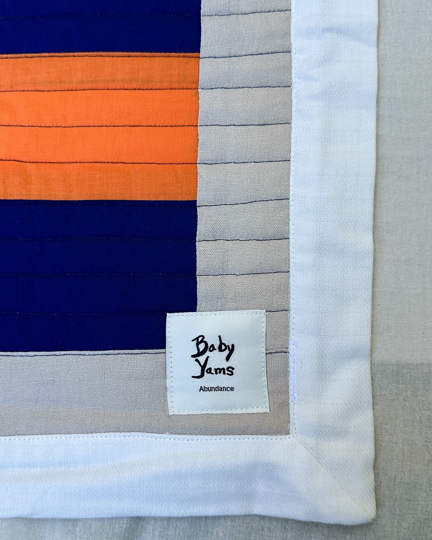 Abundance Baby Quilt - Black + Blue with Orange Sun Ray