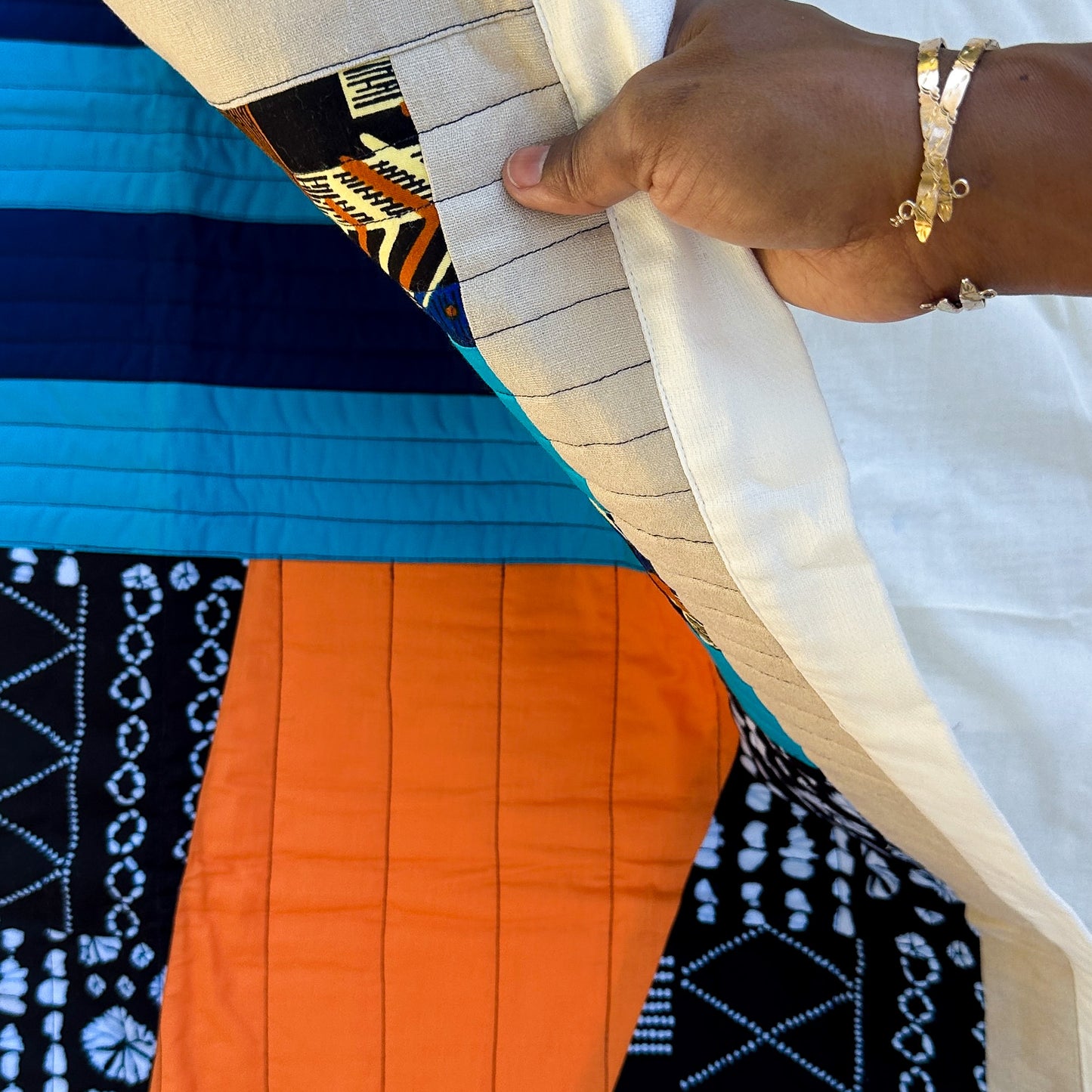 Abundance Baby Quilt - Black + Blue with Orange Sun Ray