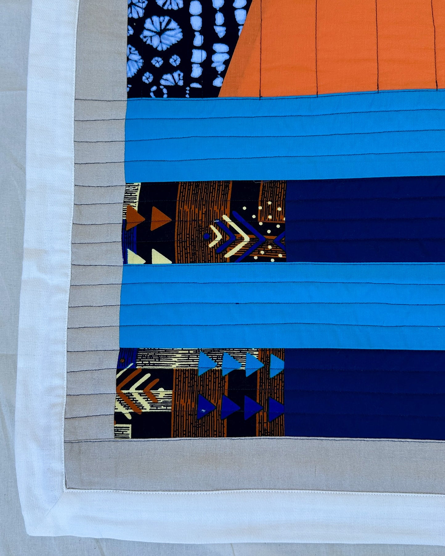Abundance Baby Quilt - Black + Blue with Orange Sun Ray
