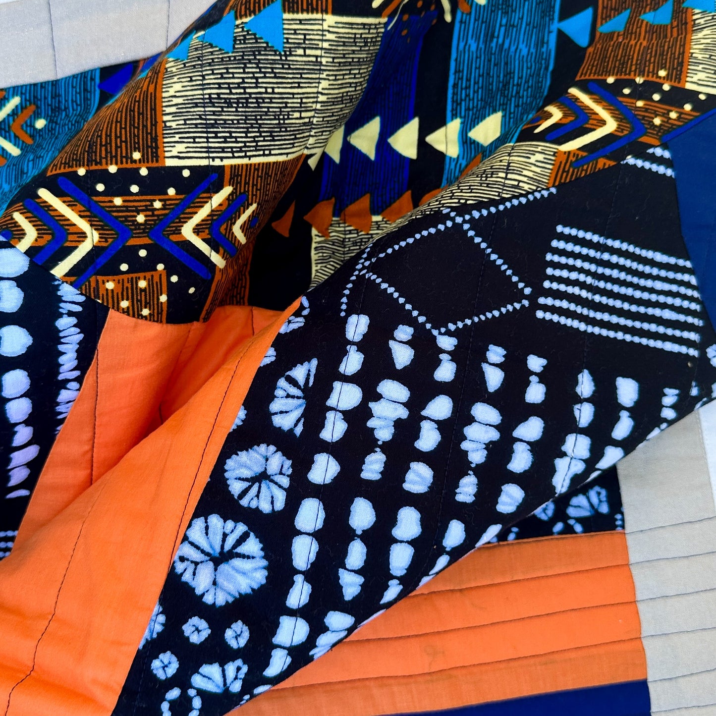 Abundance Baby Quilt - Black + Blue with Orange Sun Ray